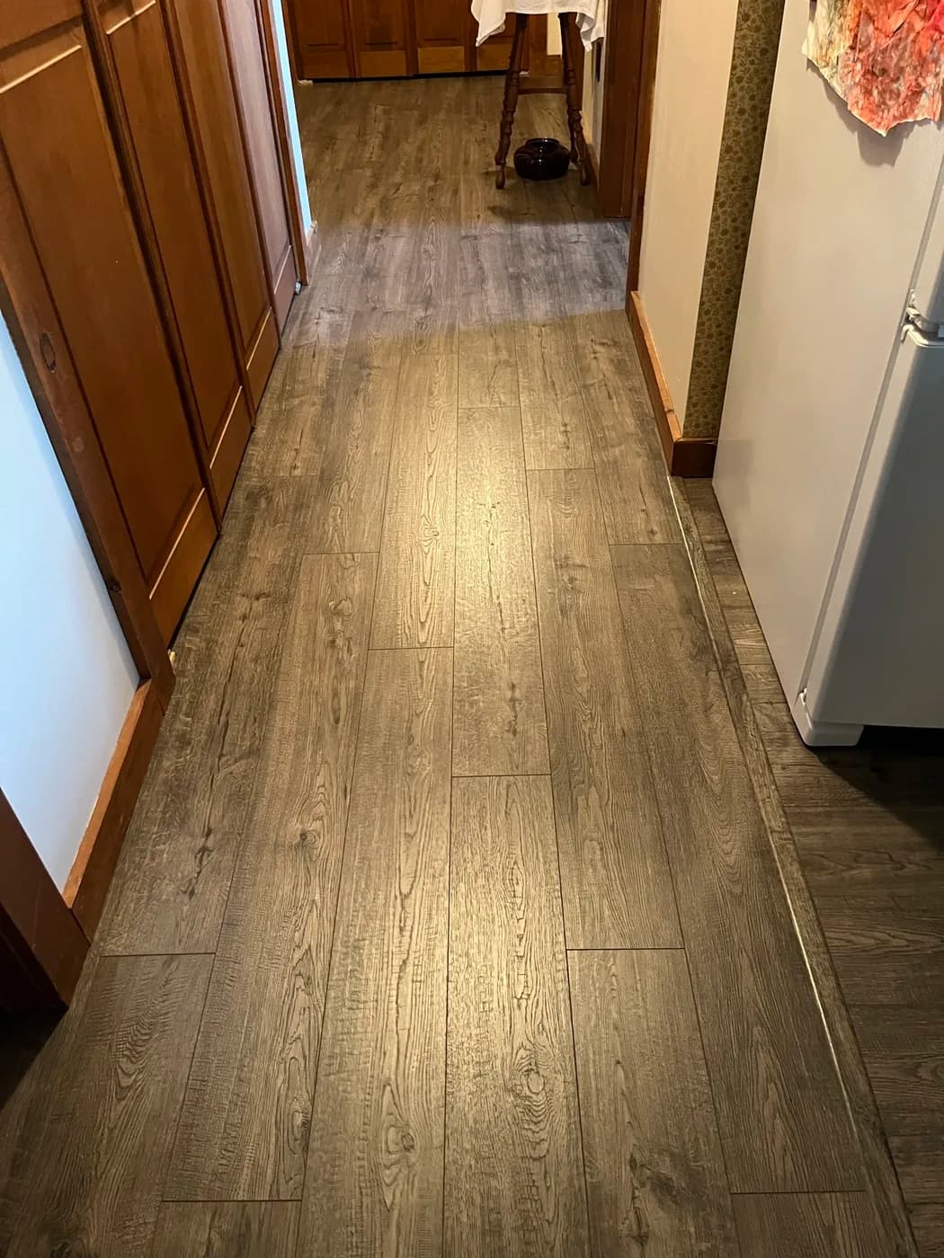 New luxury vinyl plank flooring installed in a kitchen