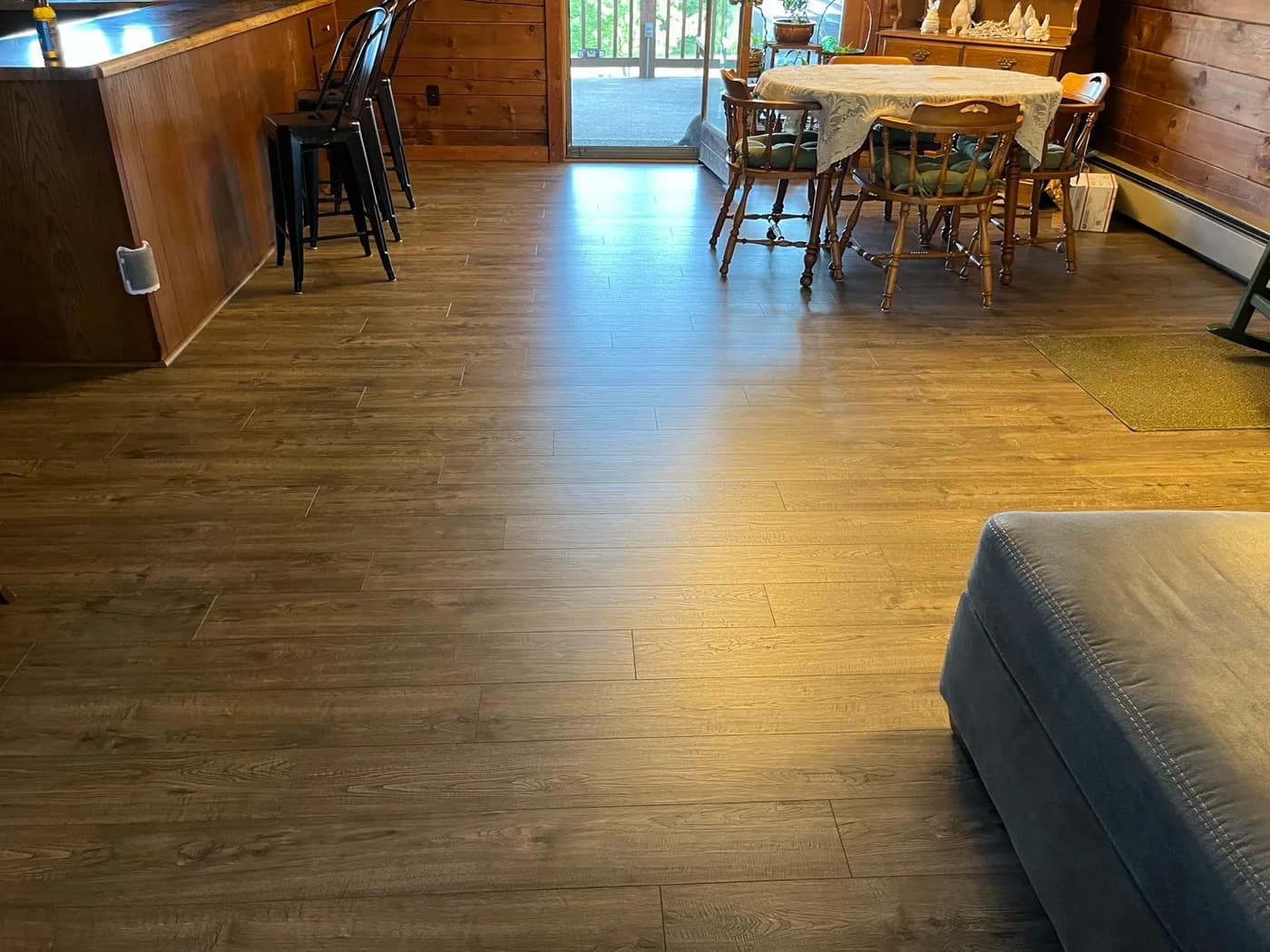 Luxury vinyl plank flooring in an open-concept living room