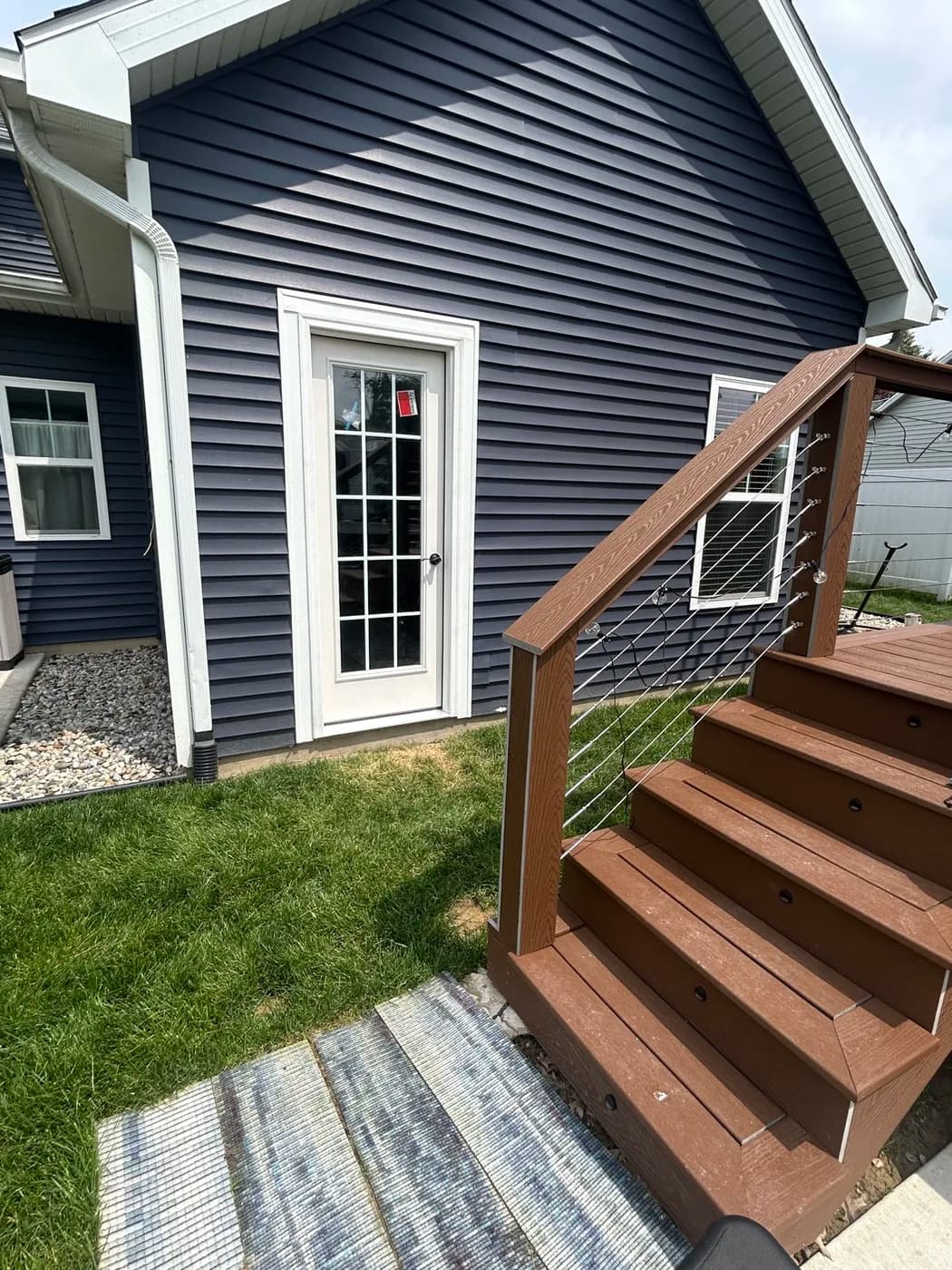 Pergola deck with composite stairs and cable rail detail